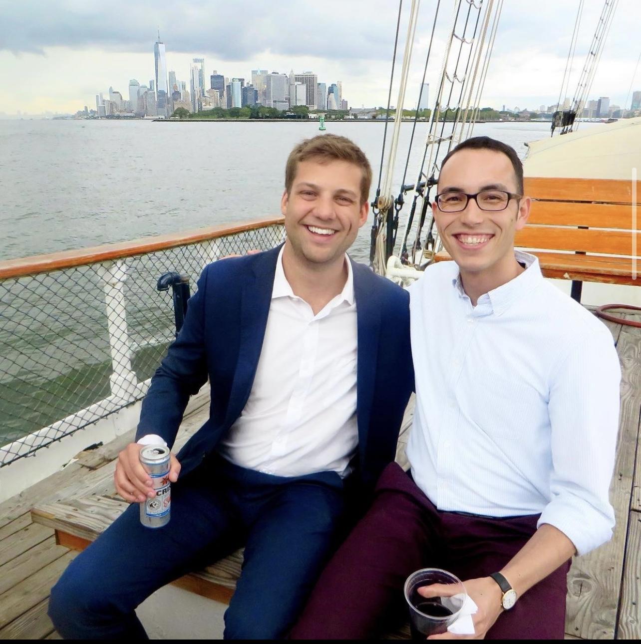 2 men on a boat tour of New York harbor